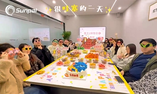 Photo capturing a festive birthday event for February birthday celebrants at Sunpal.