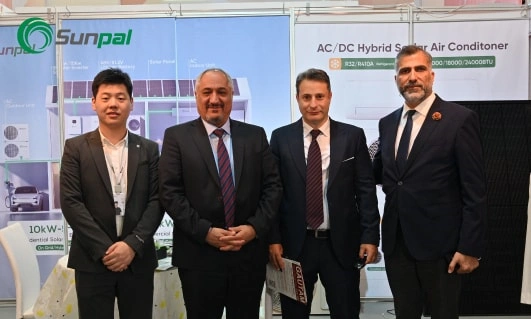 Group photo at the Sunpal booth showcasing solar products at Middle East Energy 2025.